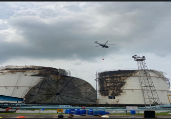 Indian Navy's Seaking Helicopter was deployed with an underslung fire bucket to assist in dousing the blaze
