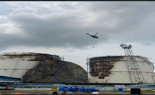 Indian Navy's Seaking Helicopter was deployed with an underslung fire bucket to assist in dousing the blaze