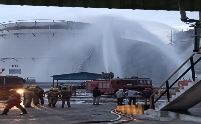 Indian Navy's Seaking Helicopter was deployed with an underslung fire bucket to assist in dousing the blaze